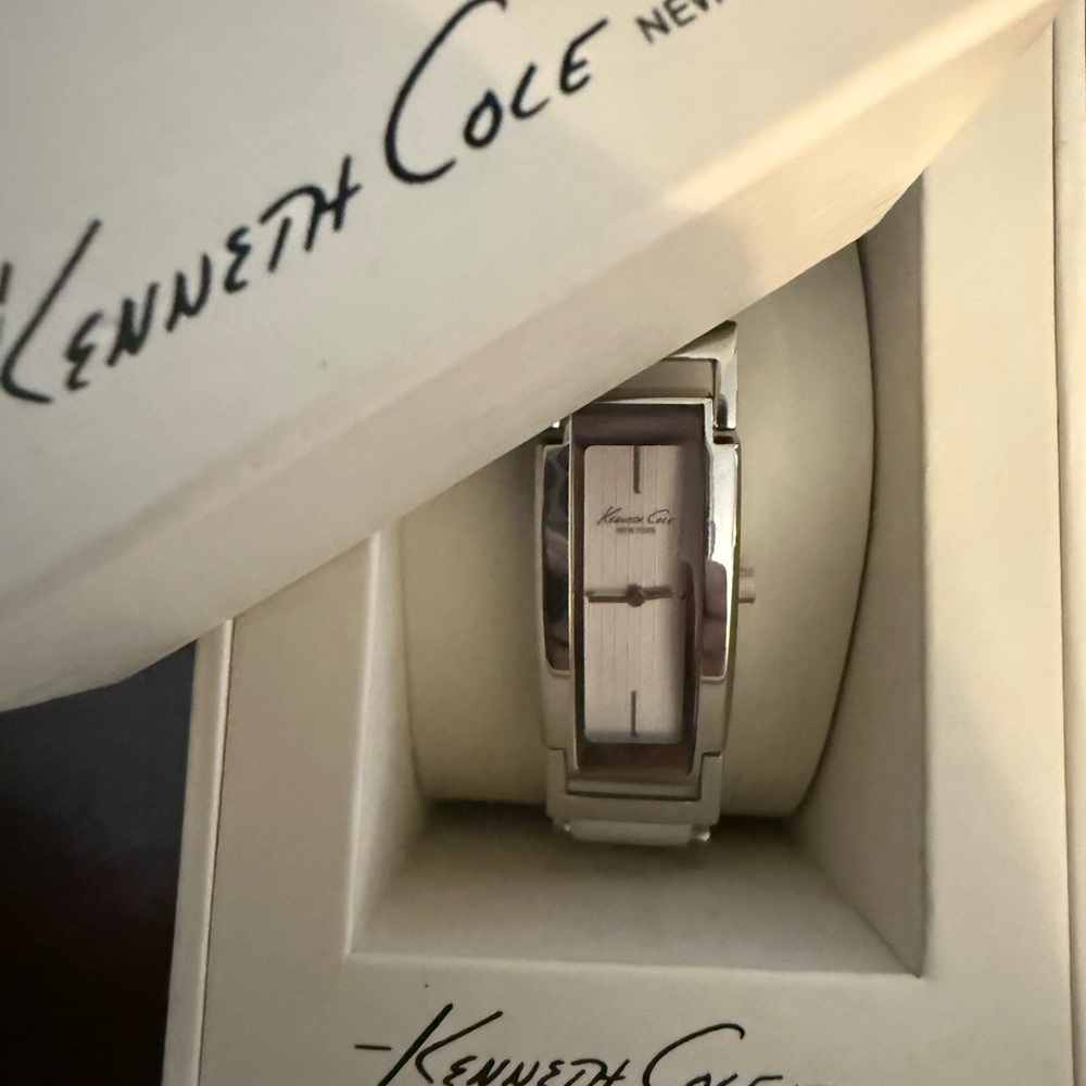 Kenneth Cole silver watch with white leather strap